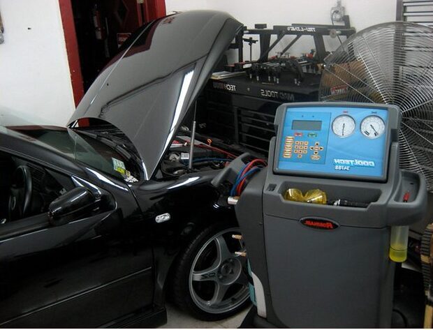 Car AC Mechanics performing AC Check at Auto Service Experts.